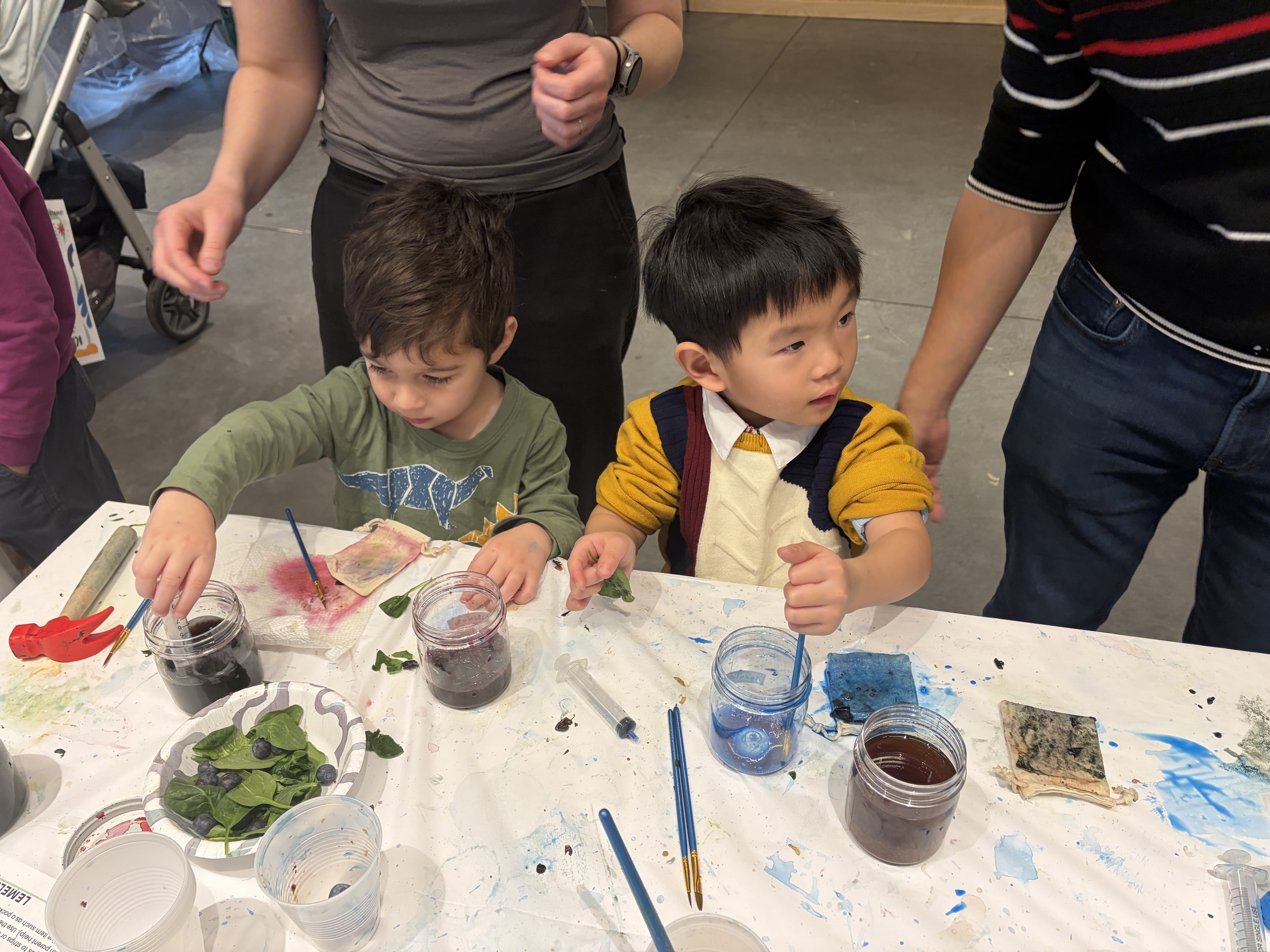 Young boys dyeing bags
