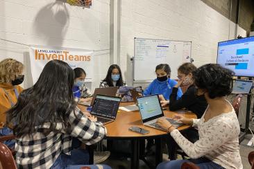 Buzzband members working on tasks.
