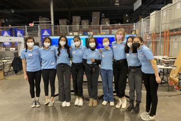 The BuzzBand team poses before their MGTR.